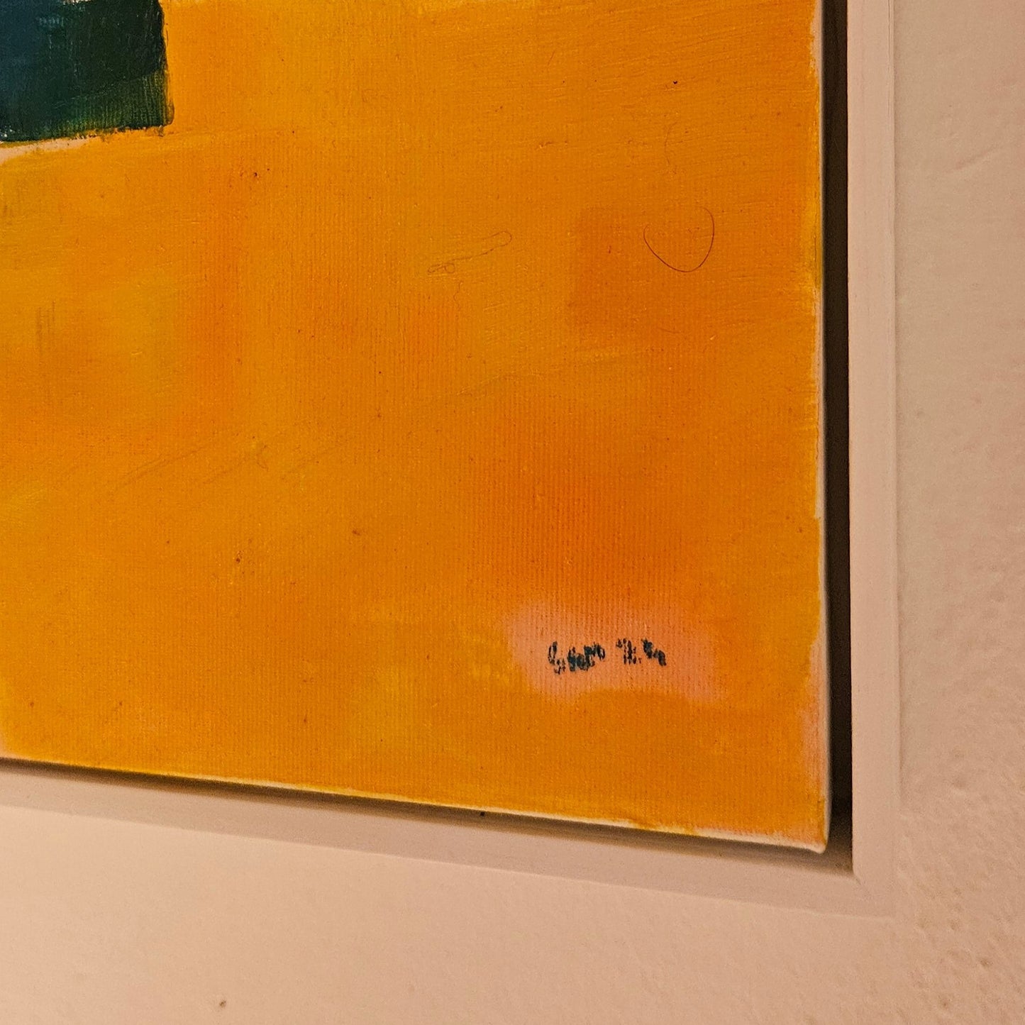 Corner of a framed oil painting with signature Sam 24 in bottom right hand corner.