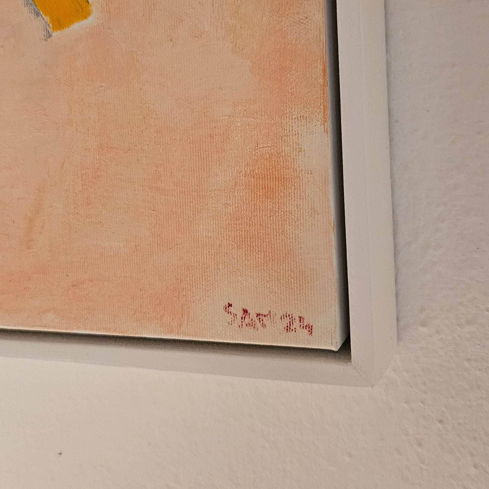 Corner of painting with white frame with artist's name, Sam 24. 